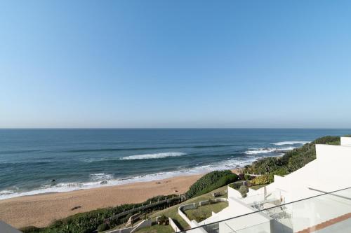 a view of the beach from the balcony of a house at Chaka Terraces 10 in Ballito