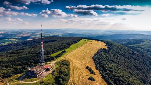 an aerial view of a communication tower on a hill at V srdci mesta II in Stará Turá