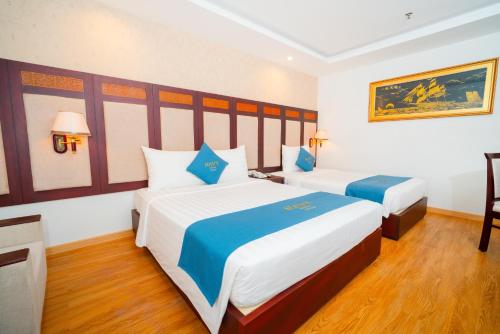 Cama o camas de una habitación en Galliot Hotel Nha Trang