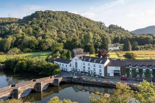 an aerial view of the river inn with a bridge at The Swan Hotel and Spa in Newby Bridge