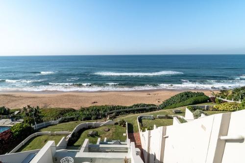 a view of the ocean from the balcony of a house at Chaka Terraces 10 in Ballito