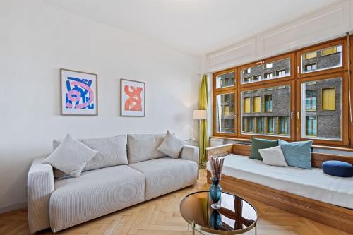 a living room with a couch and a window at Villa Seeblick 1908 in Bregenz