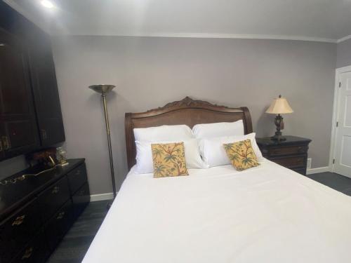 a bedroom with a large white bed with two pillows at Best value 3 Huge Bedrooms-Multiple parkings in Willmar