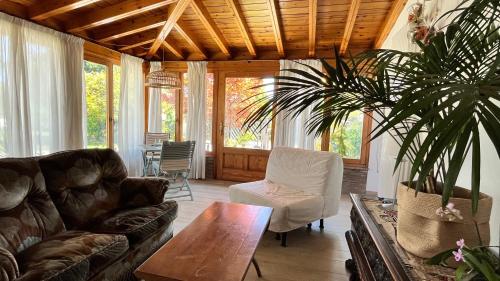 a living room with a couch and a table at Acero Rosso in Fontane