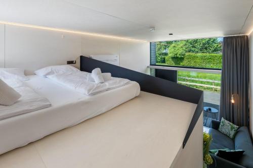 Posteľ alebo postele v izbe v ubytovaní KODA LOFT - Urlaub im Tiny House Bodensee