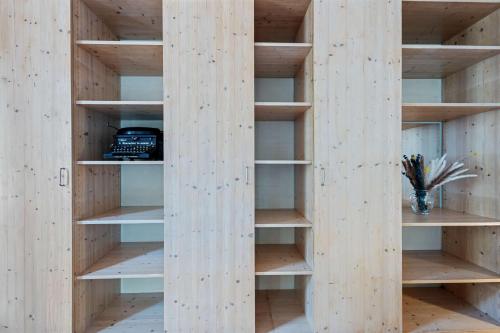 a book shelf in a room with wooden walls at Villa Seeblick 1908 in Bregenz