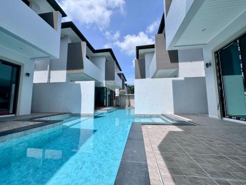 an image of a swimming pool in a house at Bay Sand Villa by Jai House Phuket in Ban Klang
