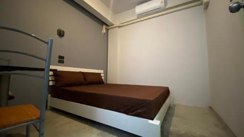 Postel nebo postele na pokoji v ubytování Capricorn hostel Yaowarat