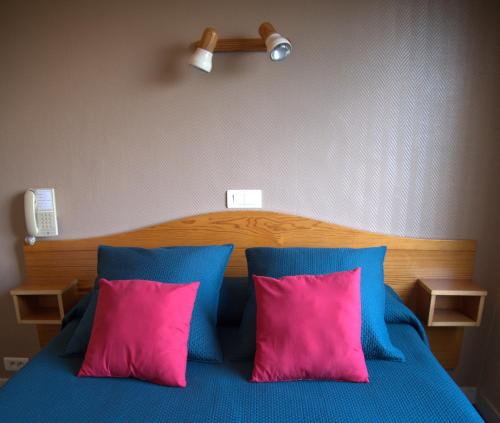 Postel nebo postele na pokoji v ubytování Hotel le Pasteur