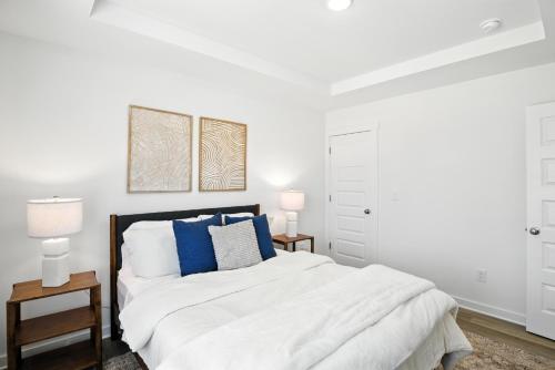 Postel nebo postele na pokoji v ubytování Discovery Point Getaway townhouse