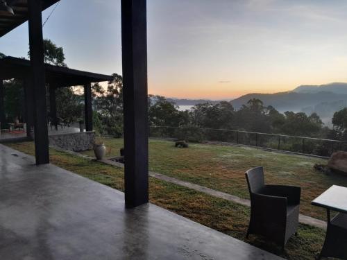 a room with a table and a view of a field at Idal Villa in Idalgashinna