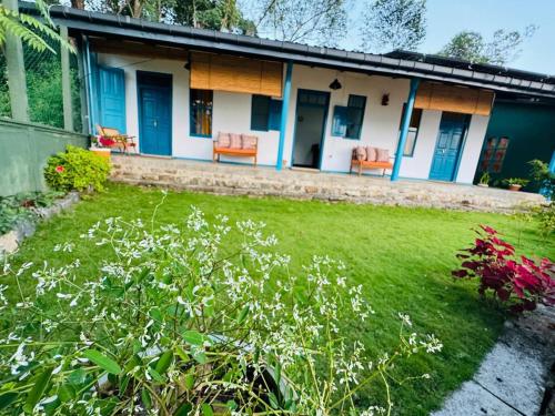 a house with orange chairs in a yard at Idal Villa in Idalgashinna