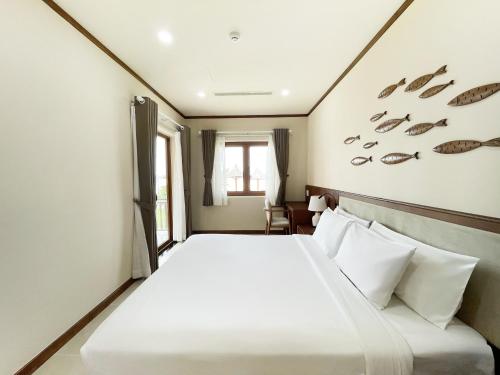 Postel nebo postele na pokoji v ubytování Phu Hai Beach Resort & Spa Phan Thiet