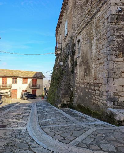 an old stone street next to a building at Parva Domus in Campolattaro