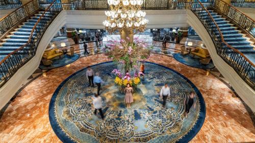 an overhead view of the lobby of a hotel with people walking around a large ch at Makati Shangri-La, Manila in Manila