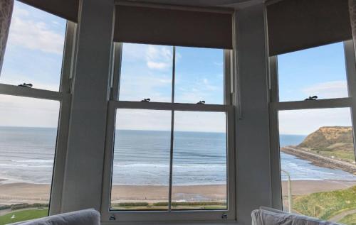 a room with a window looking out at the ocean at The Clarence Gardens Hotel, BW Signature Collection in Scarborough