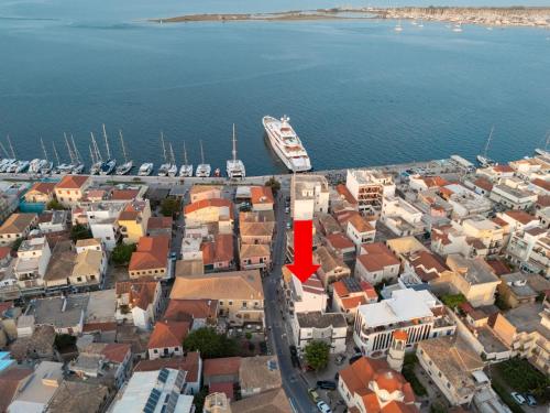 an aerial view of a city with a boat in the water at Athenee in Preveza