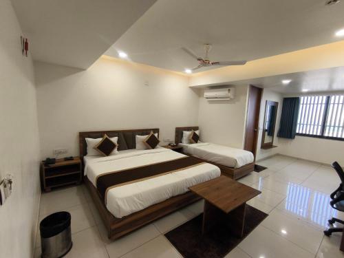 Postel nebo postele na pokoji v ubytování Hotel Shree Ji