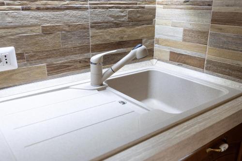 a sink with a faucet in a bathroom at La Villetta nel Parco in La Giustiniana