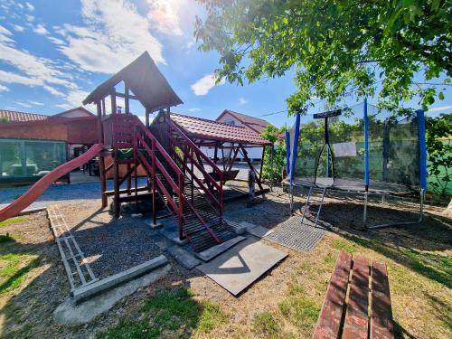 a park with a playground with a slide at Casa Rica Vendégház in Sovata