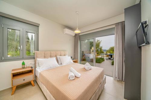 Postel nebo postele na pokoji v ubytování Villa Corelli by Villa Plus