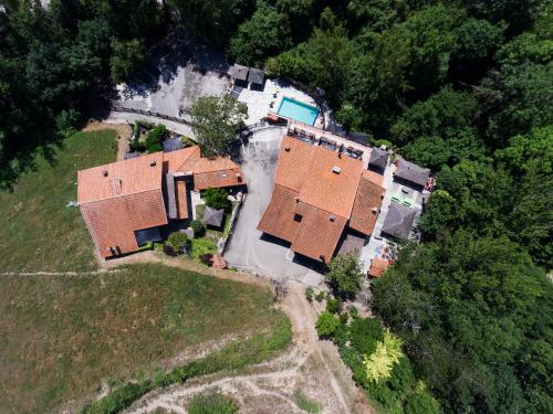 an aerial view of a house with a pool at Apartamentos Rurales & Spa La Bárcena in Enterria