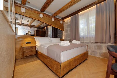 a bedroom with a large bed in a room at Planinarski dom Vošac in Makarska