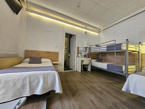 Cama o camas de una habitación en Hotel Palermo