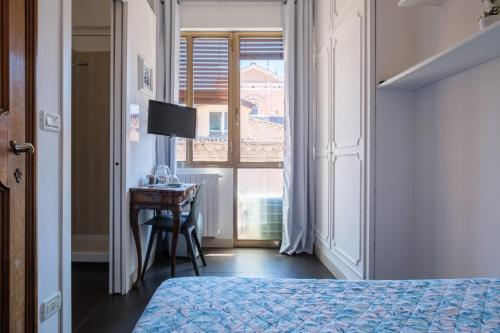 Katil atau katil-katil dalam bilik di Cristina Rossi Bed&Breakfast