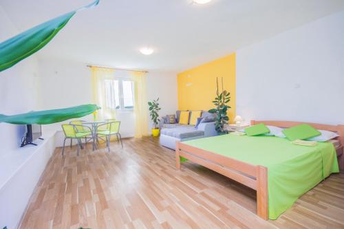 a bedroom with a bed and a living room at Pula Istria Apartments in Pula
