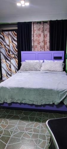 Katil atau katil-katil dalam bilik di Tatskee Homestay