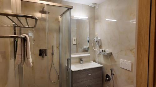 a bathroom with a shower and a sink and a shower at Hotel Brianza in Milan