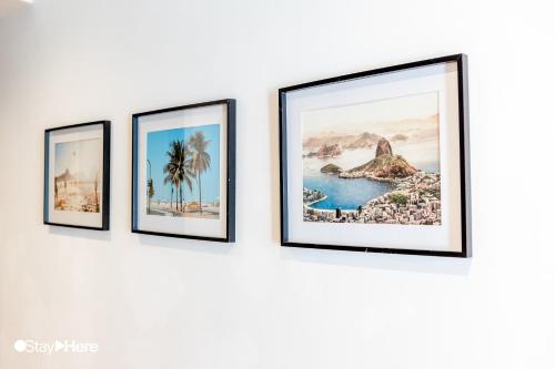 a group of four framed photographs on a wall at Stayhere Casablanca - Gauthier 1 - Modern Residence in Casablanca