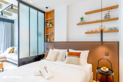 a bedroom with a large bed and a couch at Stayhere Casablanca - Gauthier 1 - Modern Residence in Casablanca