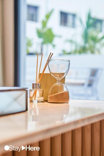 an hourglass sitting on top of a counter at Stayhere Casablanca - Gauthier 1 - Modern Residence in Casablanca