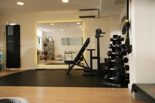 a room with a gym with a lot of equipment at Hotel Joan Miró Museum in Palma de Mallorca
