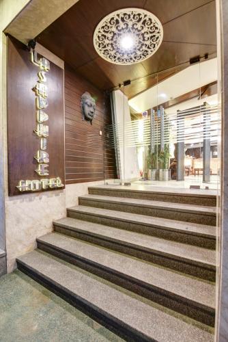 a set of stairs leading to a building at Airport La Sapphire Hotel & Restaurant in New Delhi