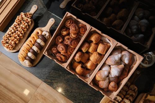 a bunch of different types of bread and pastries at Hotel Joan Miró Museum in Palma de Mallorca