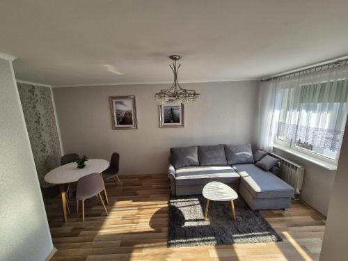 Posezení v ubytování Apartament przy parku