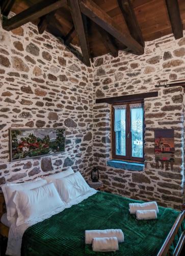 Postel nebo postele na pokoji v ubytování Αρχοντικό Πανόραμα