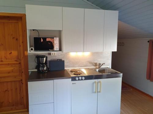 Η κουζίνα ή μικρή κουζίνα στο Apartment with loft, office if you need this
