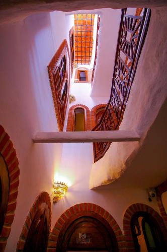 an overhead view of a staircase in a building at Riad Bab Mahrouk in Chefchaouene