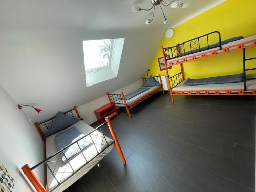 a room with two bunk beds and a couch at Ferienhaus Haus Auenland in Nohfelden