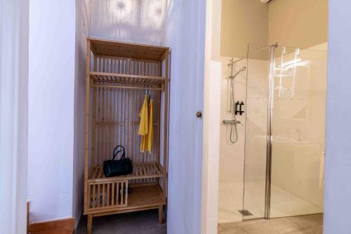 a bathroom with a walk in shower and a glass shower stall at La Morada Mas Hermosa in Marbella