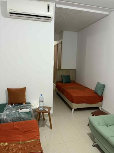 En eller flere senge i et værelse på S1 résidence avec piscine et Pied dans l'eau