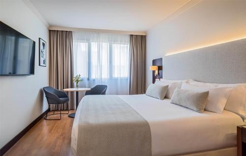 Uma cama ou camas num quarto em Occidental Granada