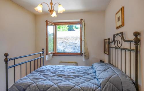a bedroom with a bed and a window at Lovely Home In Careggine in Careggine
