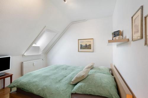 a bedroom with a bed with a dolphin pillow at Schöne Dachgeschoss Wohnung in Warstein
