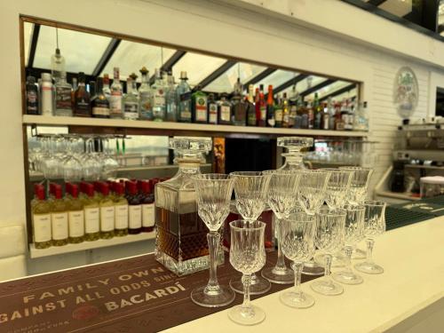 a group of wine glasses sitting on a counter at Hotel Old Town in Batumi