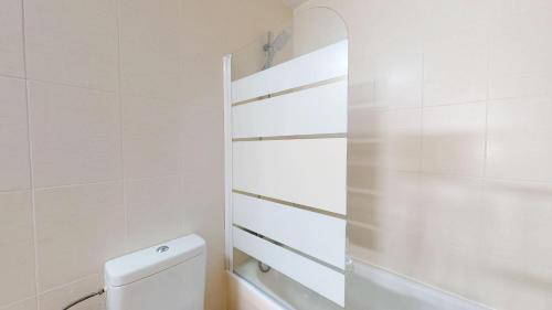 a white bathroom with a toilet and a shower at Casa Armstrong ST-Murcia Holiday Rentals Property in Roldán